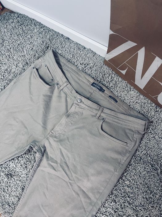 Meskie spodnie jeansy bezowe Dressmann rozm 42/43
