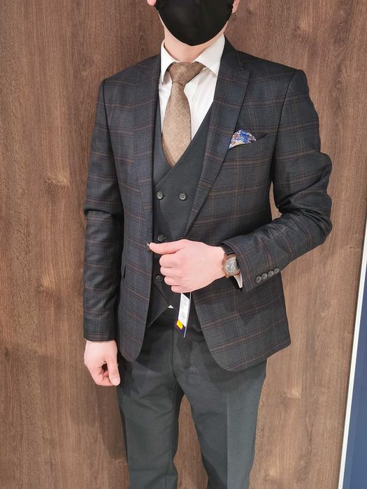Elegancki garnitur męski - Kraviec, wełna 100% Rozmiar M/L Zielony 176