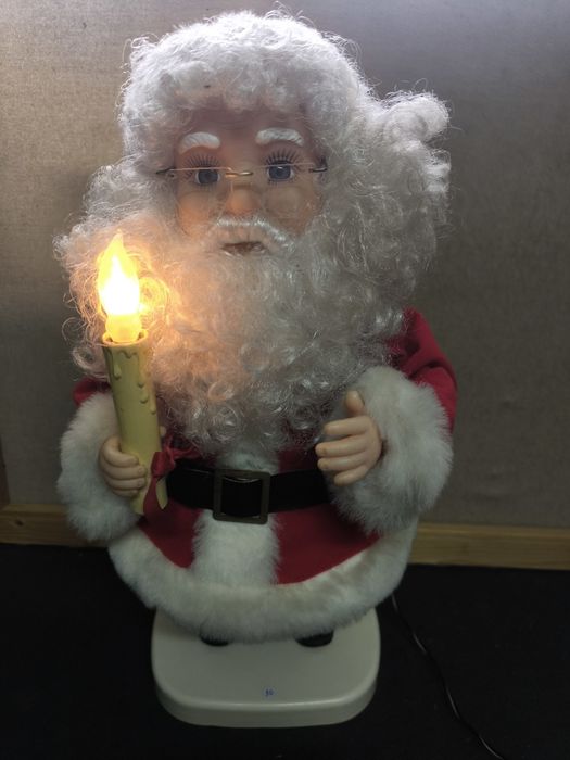 Pai Natal com Vela Luminosa e movimentos.
Figura decorativa de Pai Nat