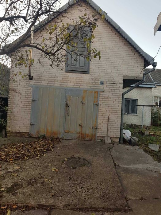 Житловий будинок та земельна ділянка 7,9 сот. м. Кам'янка-Бузька