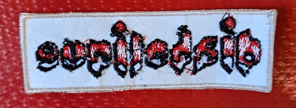 Diabolique, emblema de pano, 9 cm. x 3 cm.