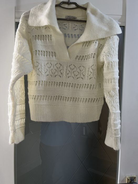 Вʼязані кофти молочного кольору