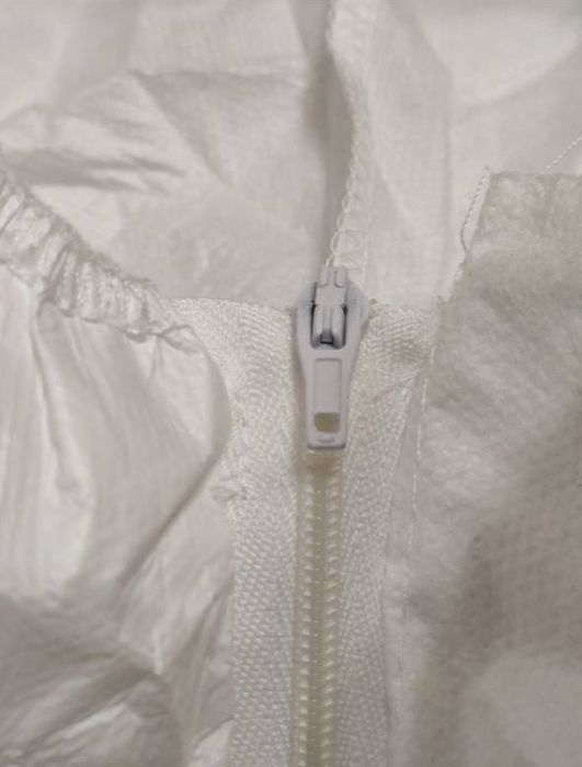 Защитный одноразовий комбинезон , малярный мелицинский костюм