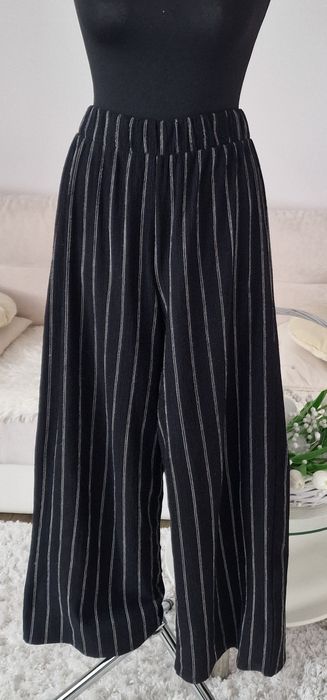 Spodnie szerokie nogawki H&M".
