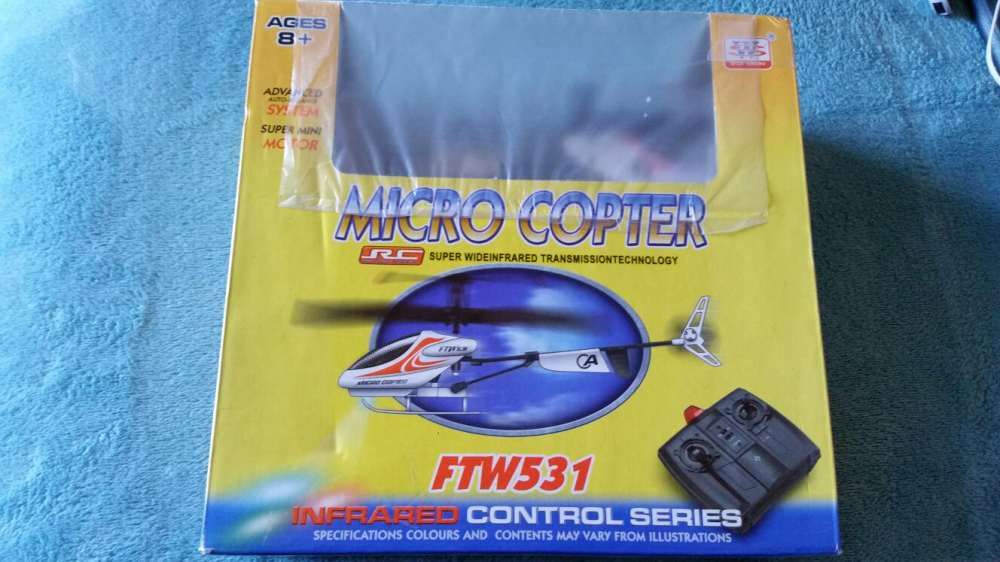 Small helicopter with wireless controller, new, still in sealed box64586414409219120
