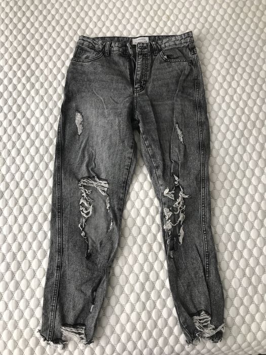 Czarne spodnie z dziurami Terranova