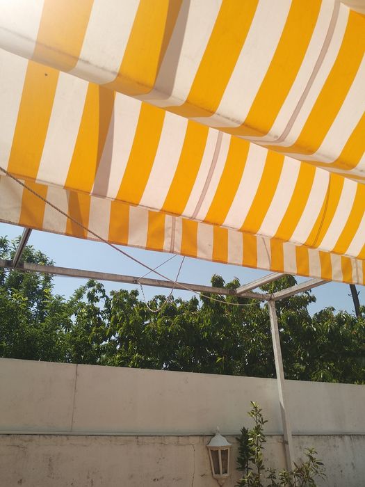 Pérgola de encostar com tecido
