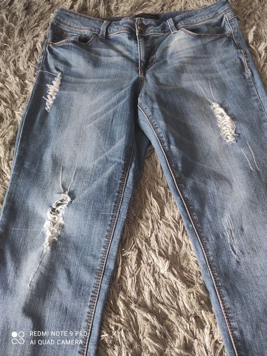Spodnie dżinsowe " porwane"