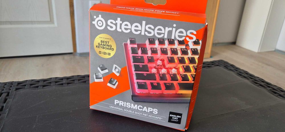 Teclado Corsair K100 RGB Layout UK + Pack Keycaps SteelSeries Prismcaps