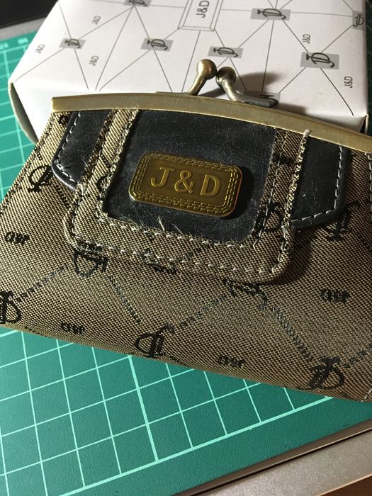 Porta moedas de mola