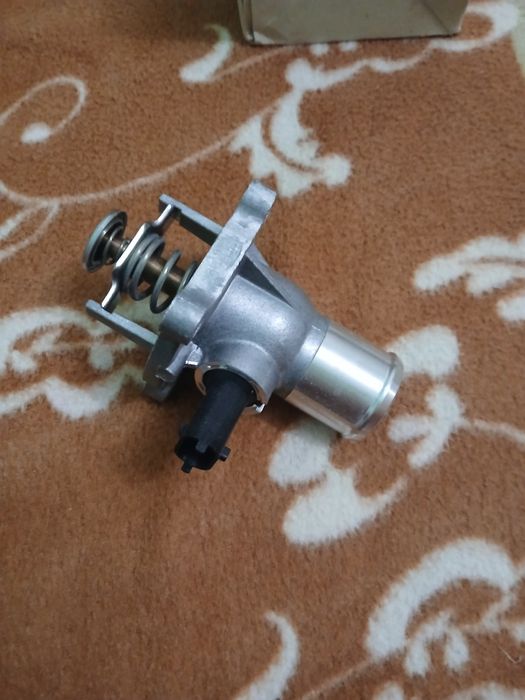 Termostat Opel Astra 3H 1,6.