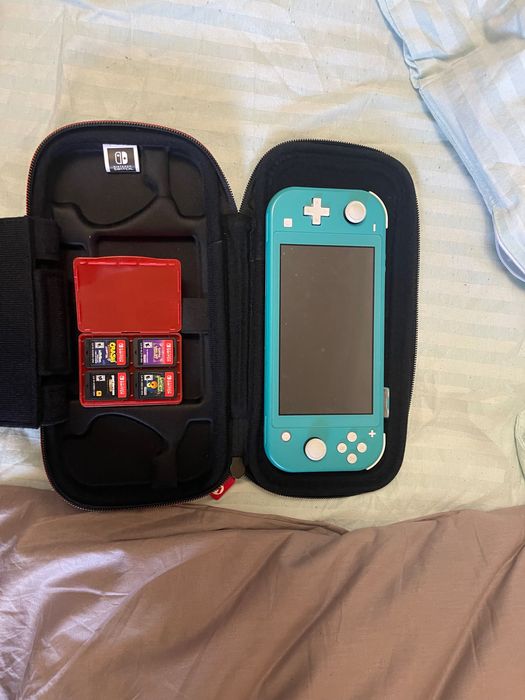 Nintendo Switch Lite with case and 4 games
