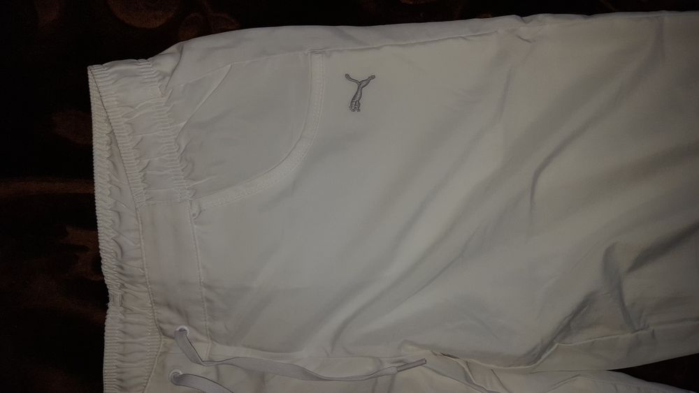 Sportowe spodnie firmy PUMA w rozmiarze L /40