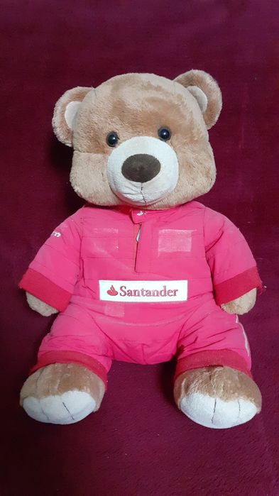 Медведь плюшевый в комбинезоне