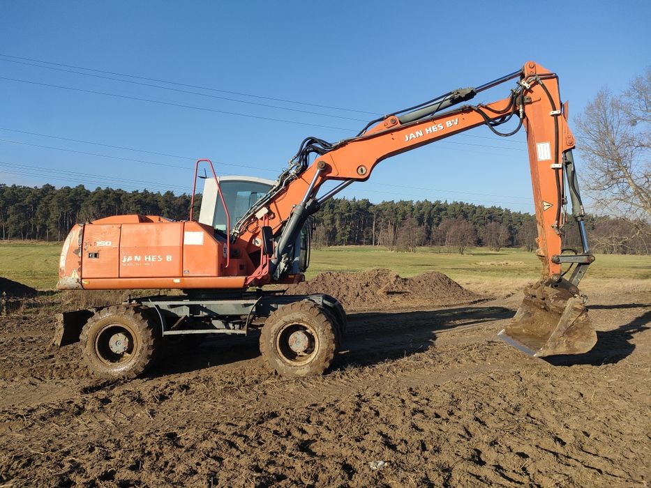 Roboty ziemne koparko-ładowarką minikoparka wyburzenia rozbiórki