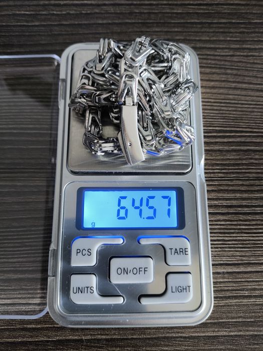 Łańcuszek męski stal szlachetna 56 cm. Waga 64,57g.
