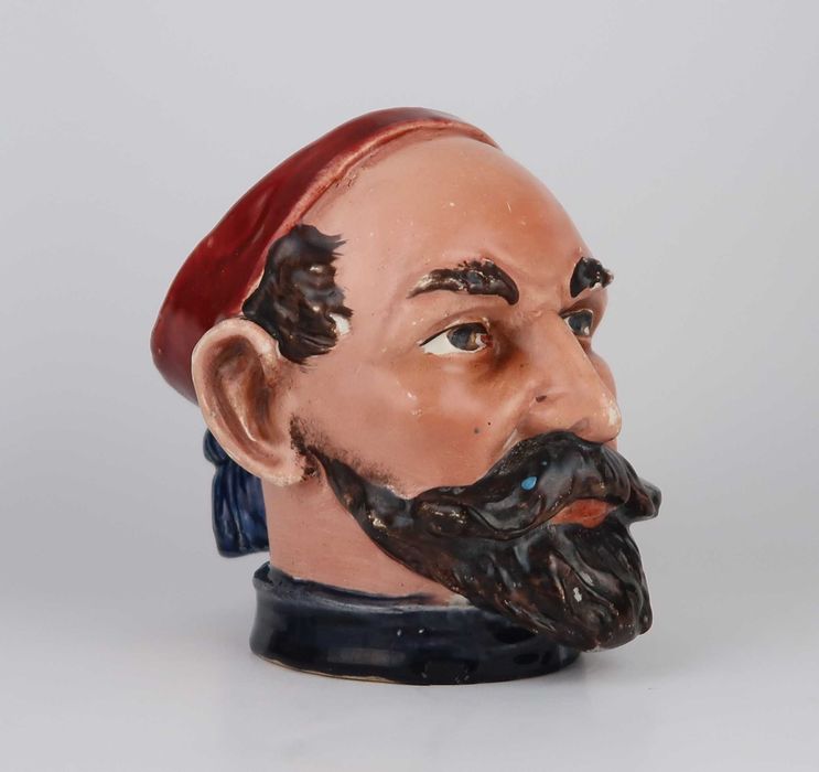 Caneca antropomórfica muito antiga em faiança