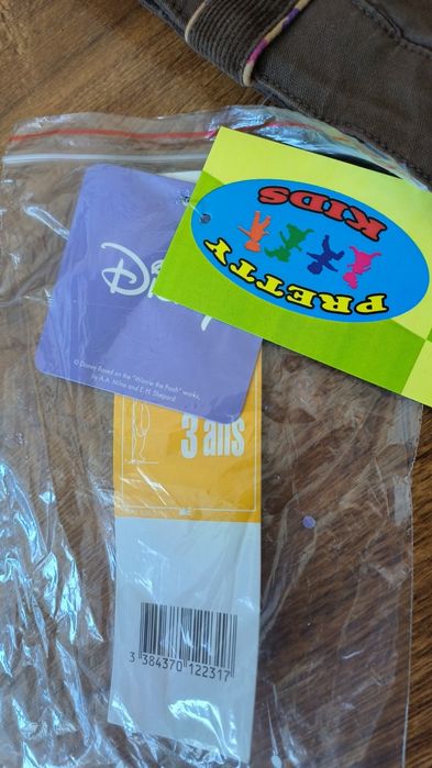 Brązowe jeansy z Kubusiem Puchatkiem