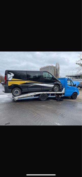 Laweta transport samochodow łodzi przyczep pomoc drogowa