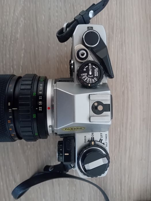 Olympus OM-10 + Olympus OM-System S Zuiko Auto-Zoom 35-70mm f/4
 Made in Japan.