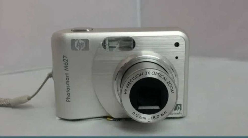 Máquina fotográfica e câmara