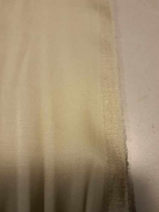 Tkanina kremowa szer.140 cm.