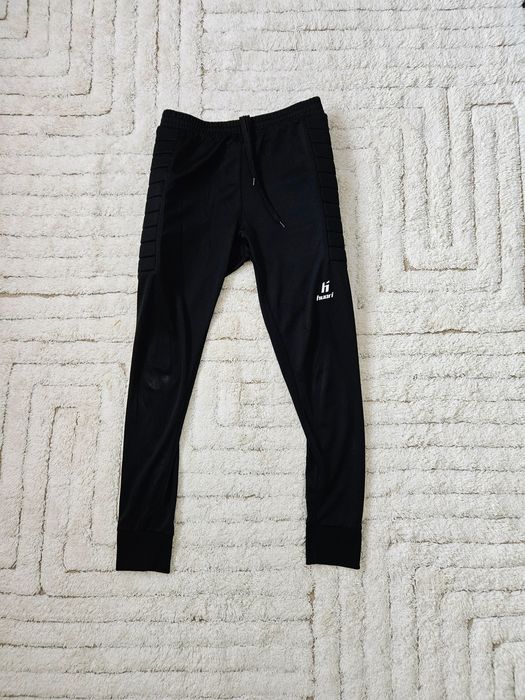 Spodnie piłkarskie Huari XL ochraniacze