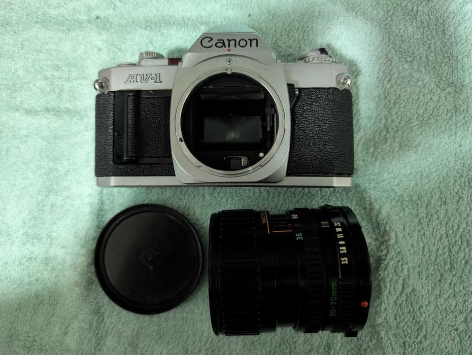 Canon AV-1 + Lente FD + Teleconversor + Filtro UV + Bolsa