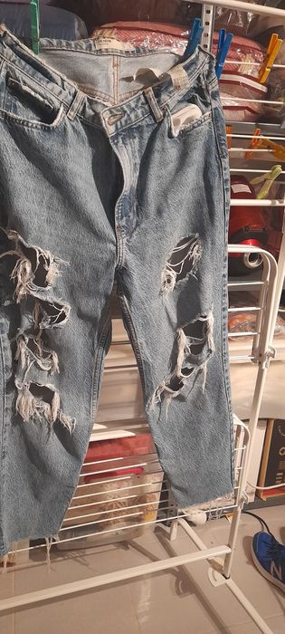 Calças de ganga rotos
