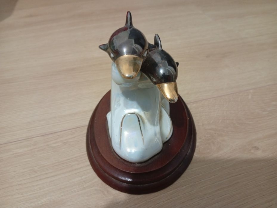 Porcelana golfinhos braco dourado