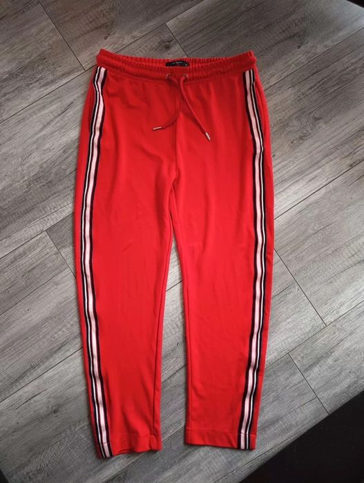 Piękne czerwone dresowe spodnie luźna nogawka rozmiar 38 lampasy reser