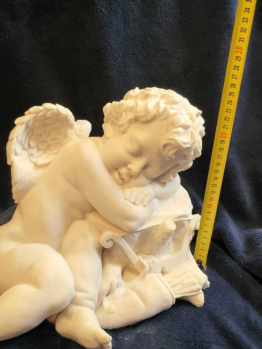 Cupido a Descansar em Marfinite