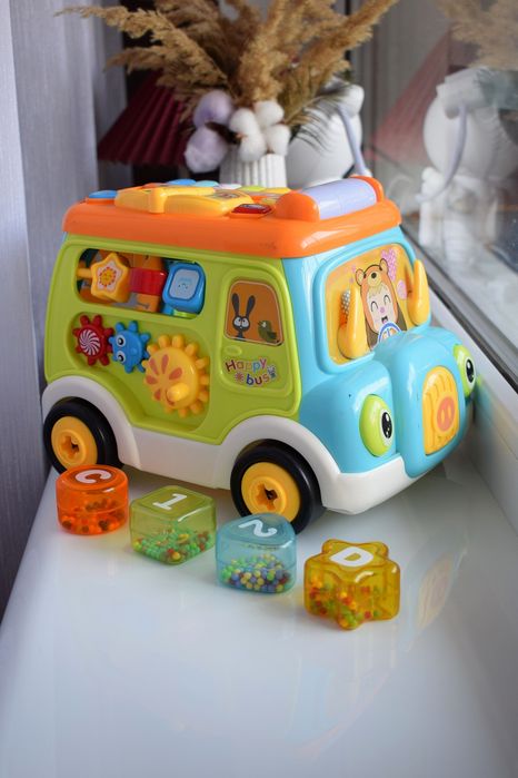 Машинка-каталка музична