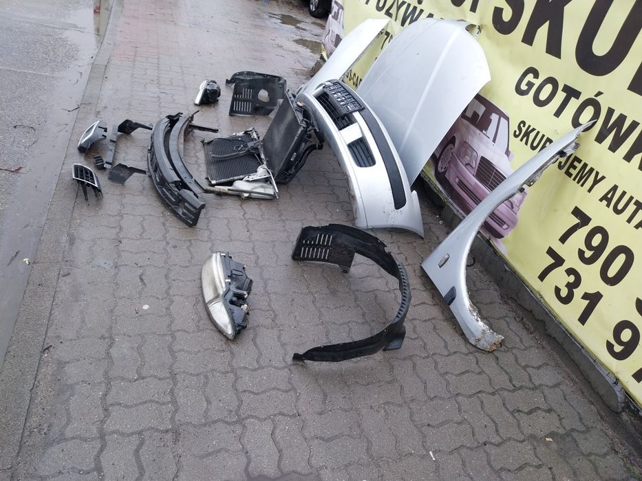 Mitsubishi Carisma zderzak  lampa chłodnice belka pas kpl