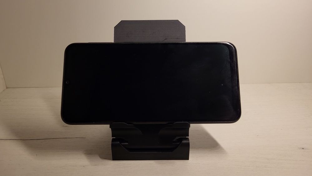 Підставка для телефона з регулюванням положення