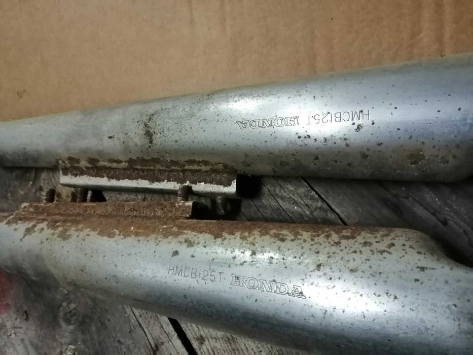 Escapes origem HONDA HMCB125T