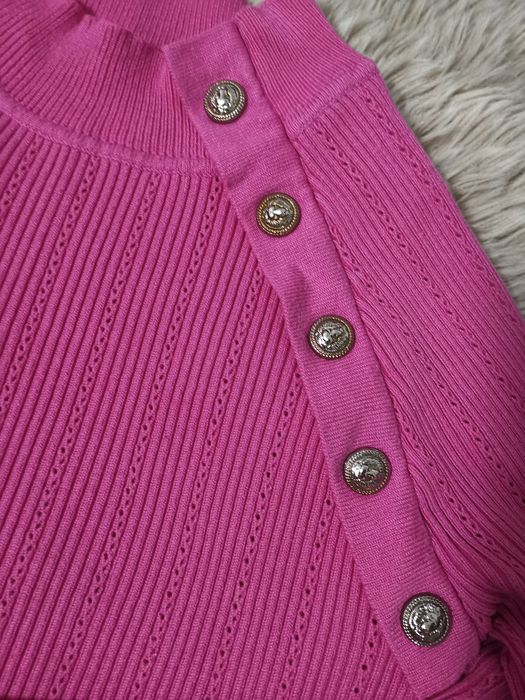 Różowy sweterek Uni
