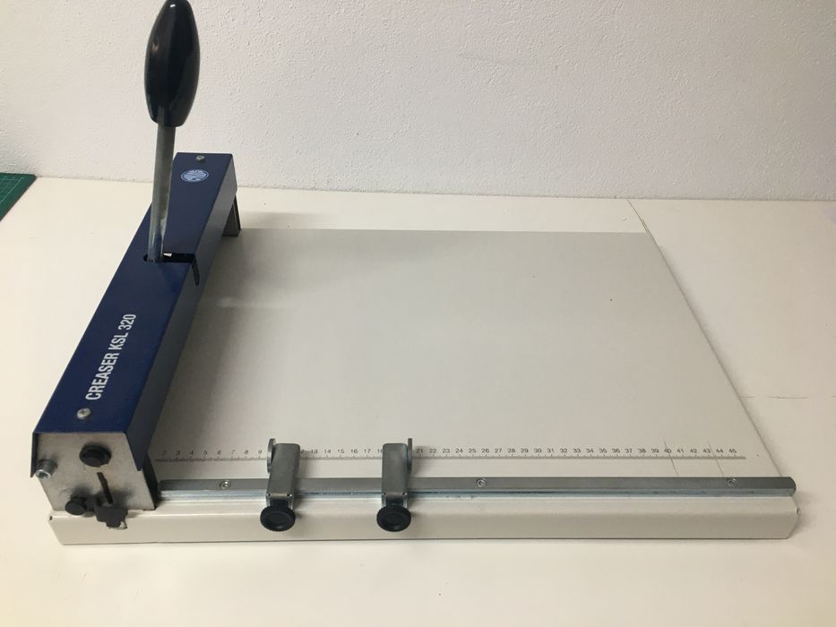 Máquina de vinco