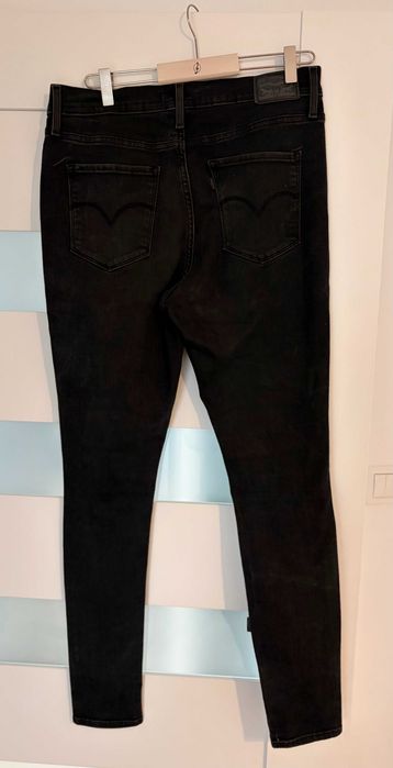 Jeansy Levi's 720 High Rise Super Skinny W31 czarne przetarcia dziury