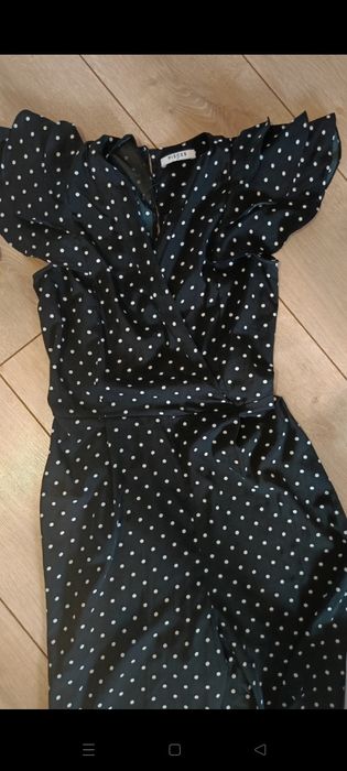 Czarny długi kombinezon w białe groszki. Rozmiar S.
