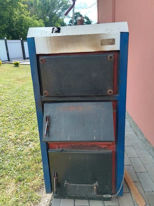 Продам твердопаливний котел потужністю 16 кВт разом з димохідним трубами