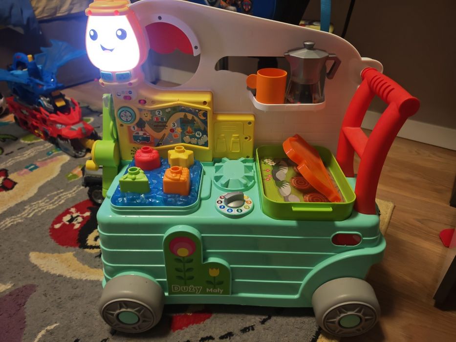 Fisher Price Wesoły Kamper Malucha pchacz jeździk grający