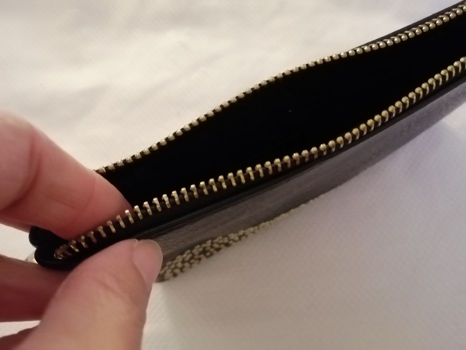 Clutch preta muito versatil