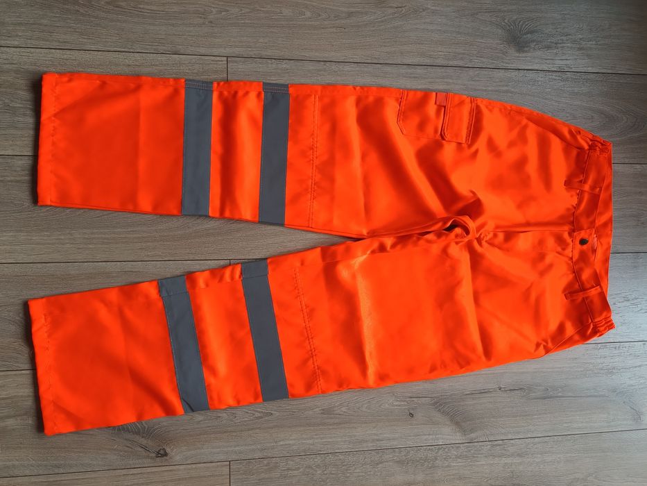 Męskie spodnie robocze pomarańczowe odblaskowe jak nowe Warrior