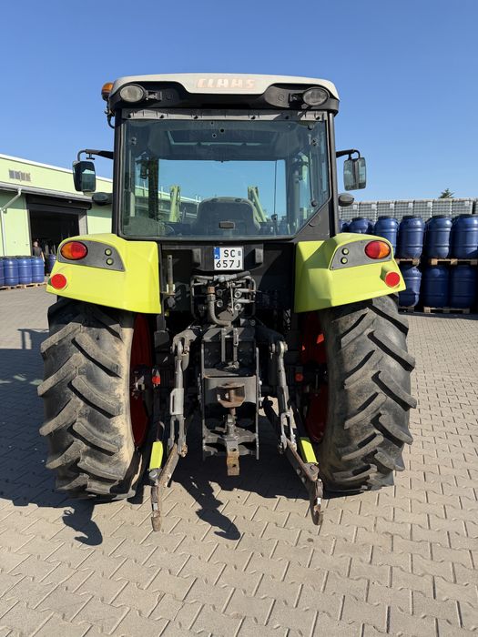 Claas Axos 330 z ładowaczem