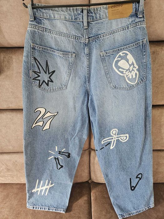 Spodnie jeansowe CROPP Super Baggy jasnoniebieskie przecierane roz 28/30