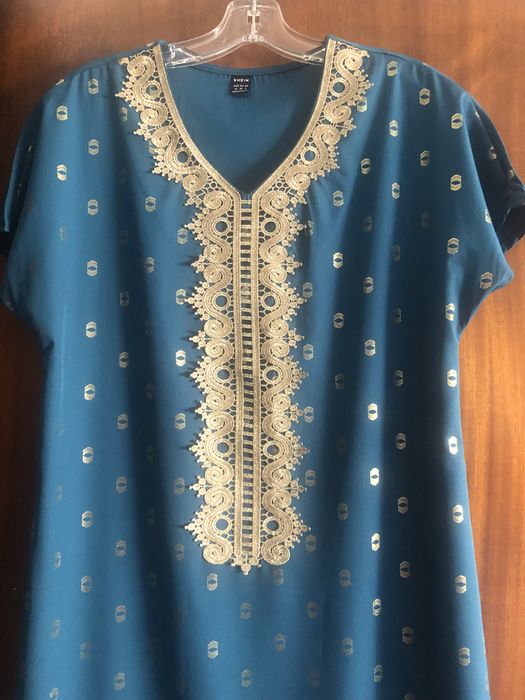 Uma  tunica nova varias pecas , e 1 vestidos novo ver fotos