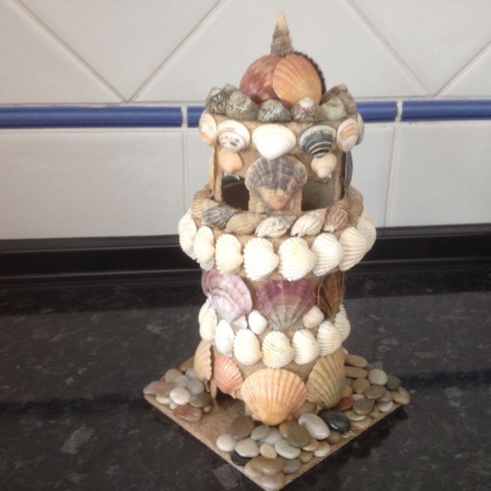 castelo feito com conchas tudo feito à mão
