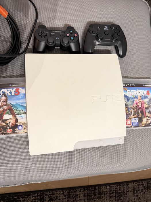 Playstation 3 SLIM WHITE  320GB + 2 pady i 2 gry