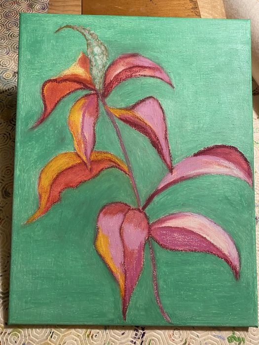 Folhas com flor em fundo turquesa